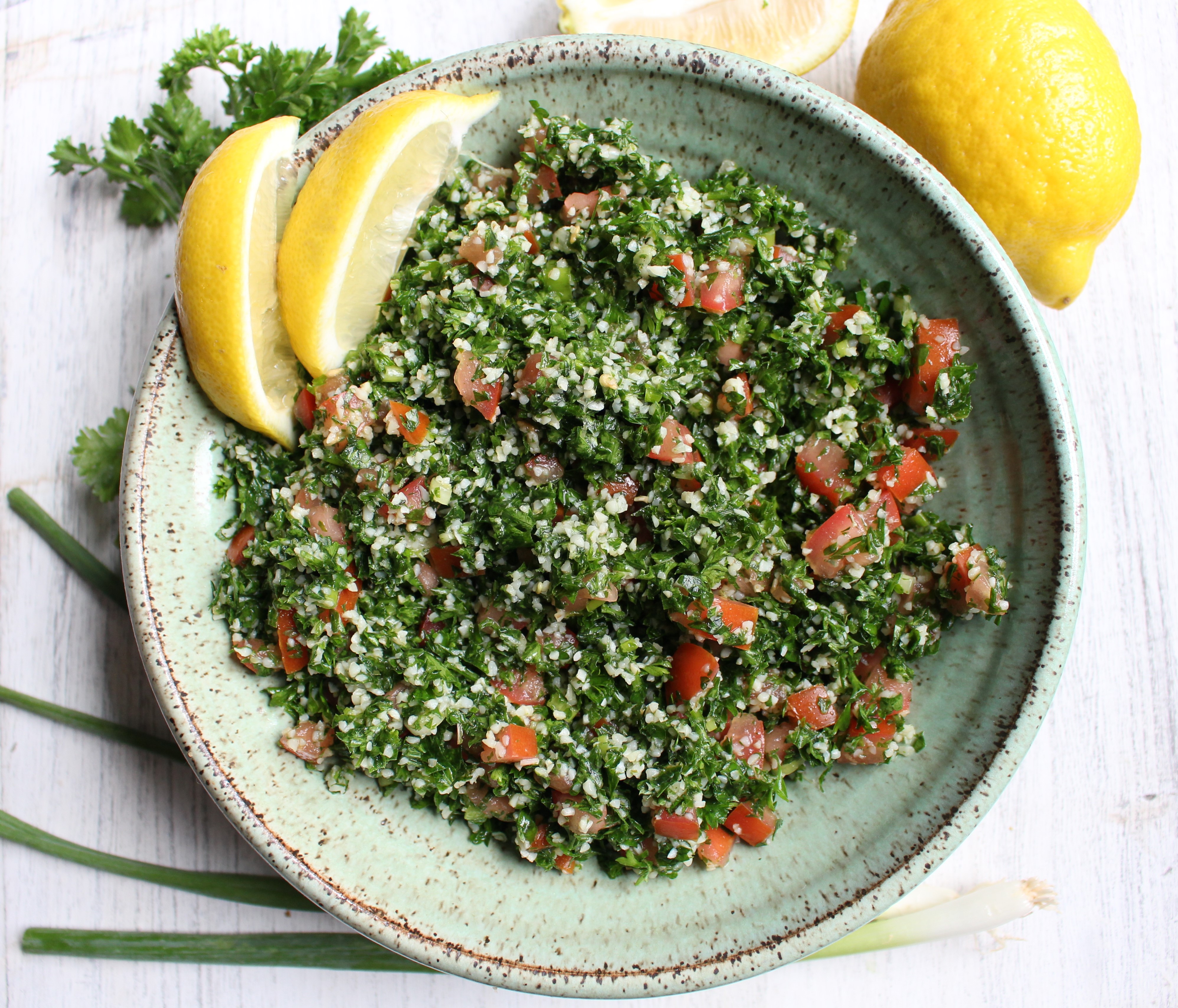 Tabbouleh - a refreshing and healthy Middle Eastern salad made with parsley, tomatoes, and bulgur. Dressed with lemon juice, olive oil, and mint, this salad is great by itself, in lettuce cups, or with avocado! 