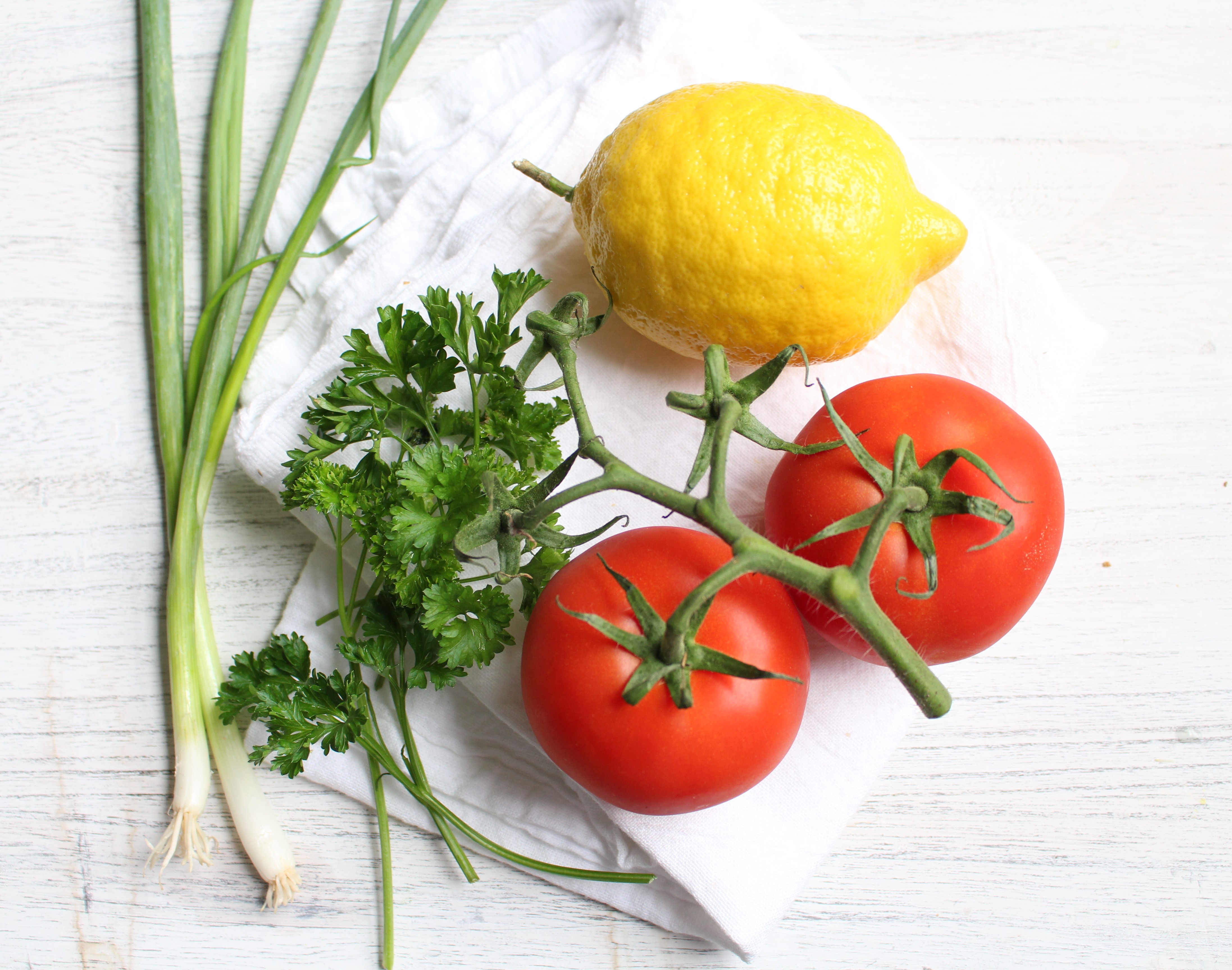 Tabbouleh - a refreshing and healthy Middle Eastern salad made with parsley, tomatoes, and bulgur. Dressed with lemon juice, olive oil, and mint, this salad is great by itself, in lettuce cups, or with avocado! 