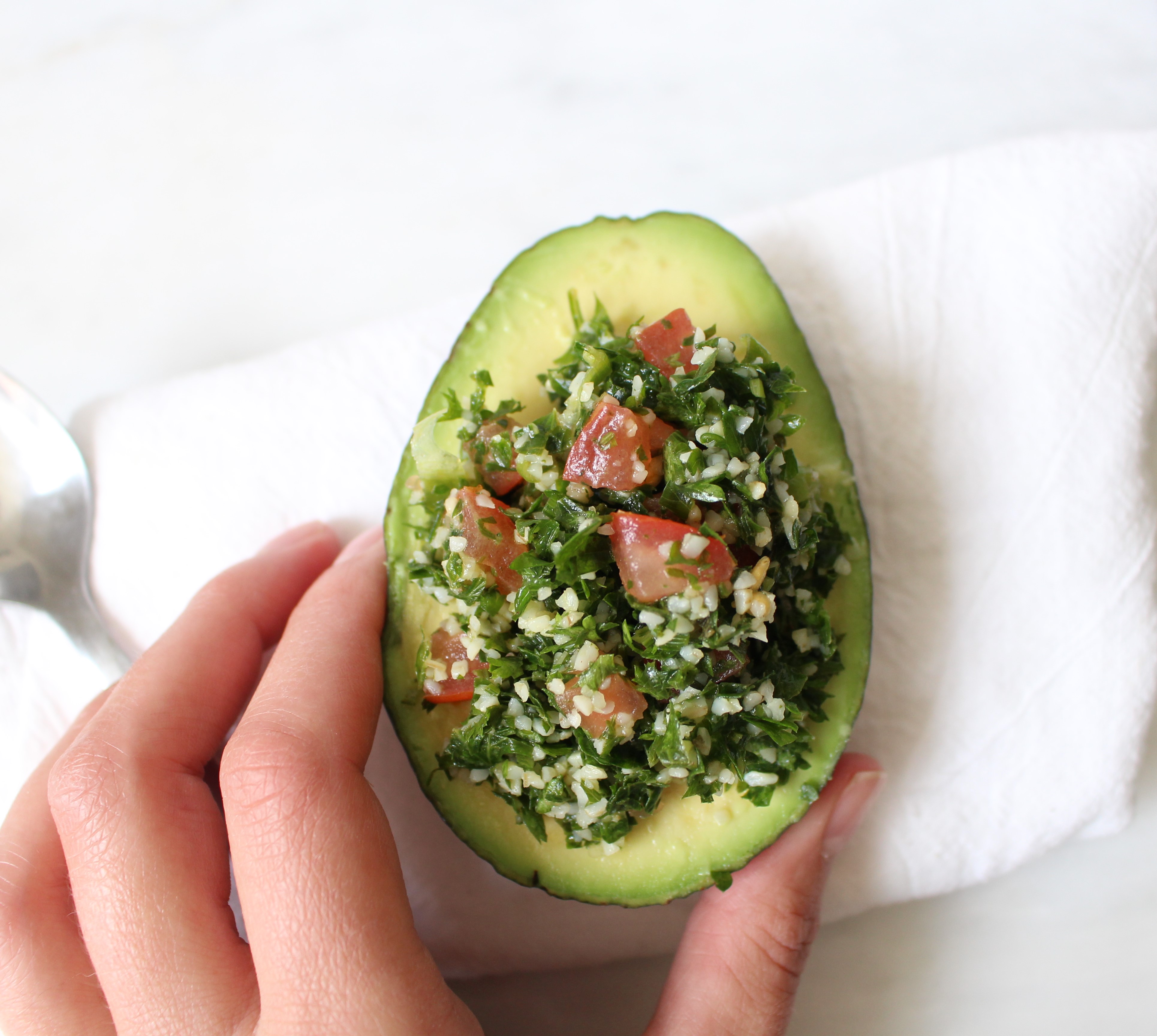 Tabbouleh - a refreshing and healthy Middle Eastern salad made with parsley, tomatoes, and bulgur. Dressed with lemon juice, olive oil, and mint, this salad is great by itself, in lettuce cups, or with avocado!