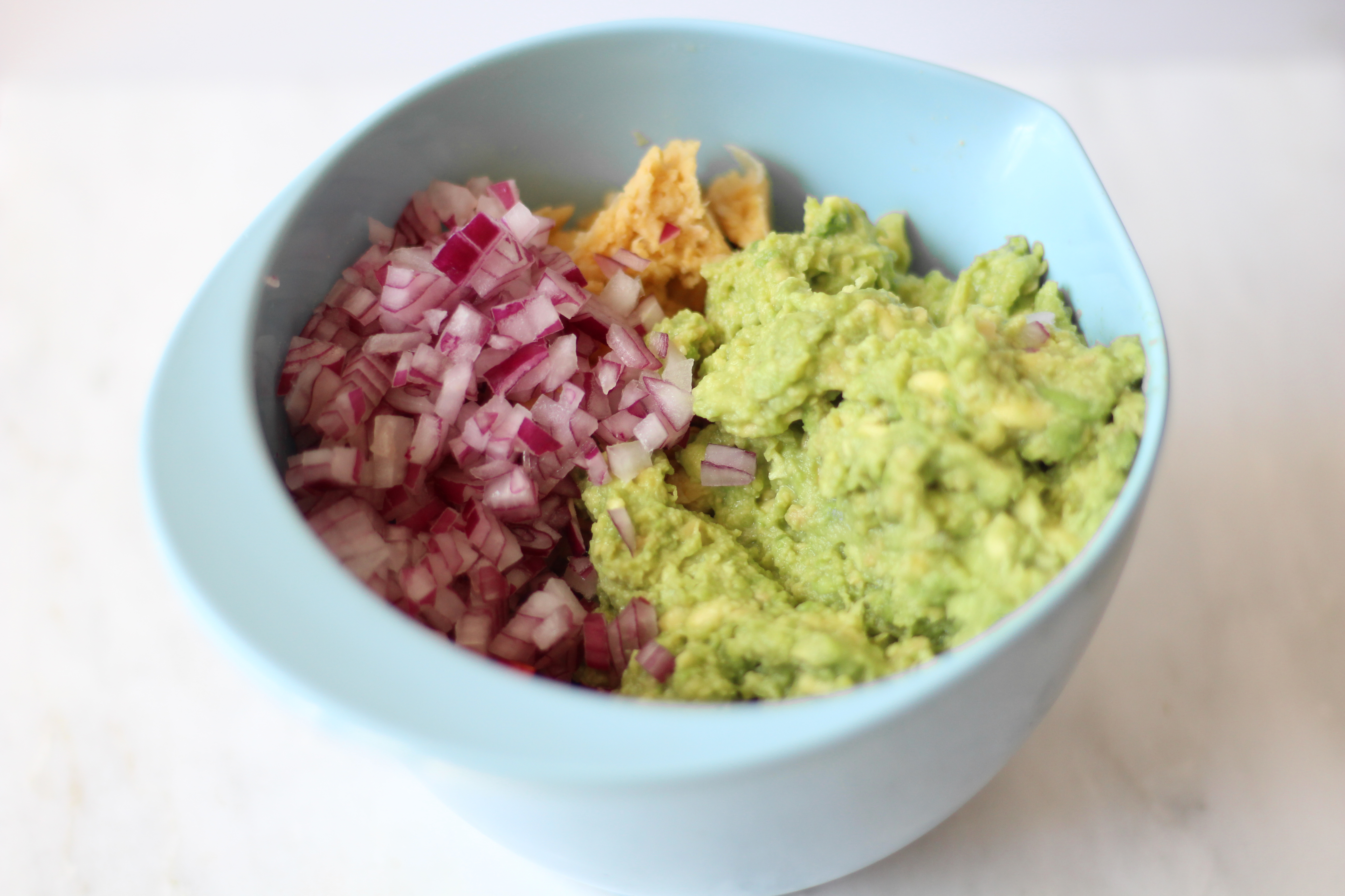 Mediterranean Chickpea Guacamole is a fun twist on traditional guacamole! Chickpeas, avocado, parsley, oregano, and lemon - the perfect snack!