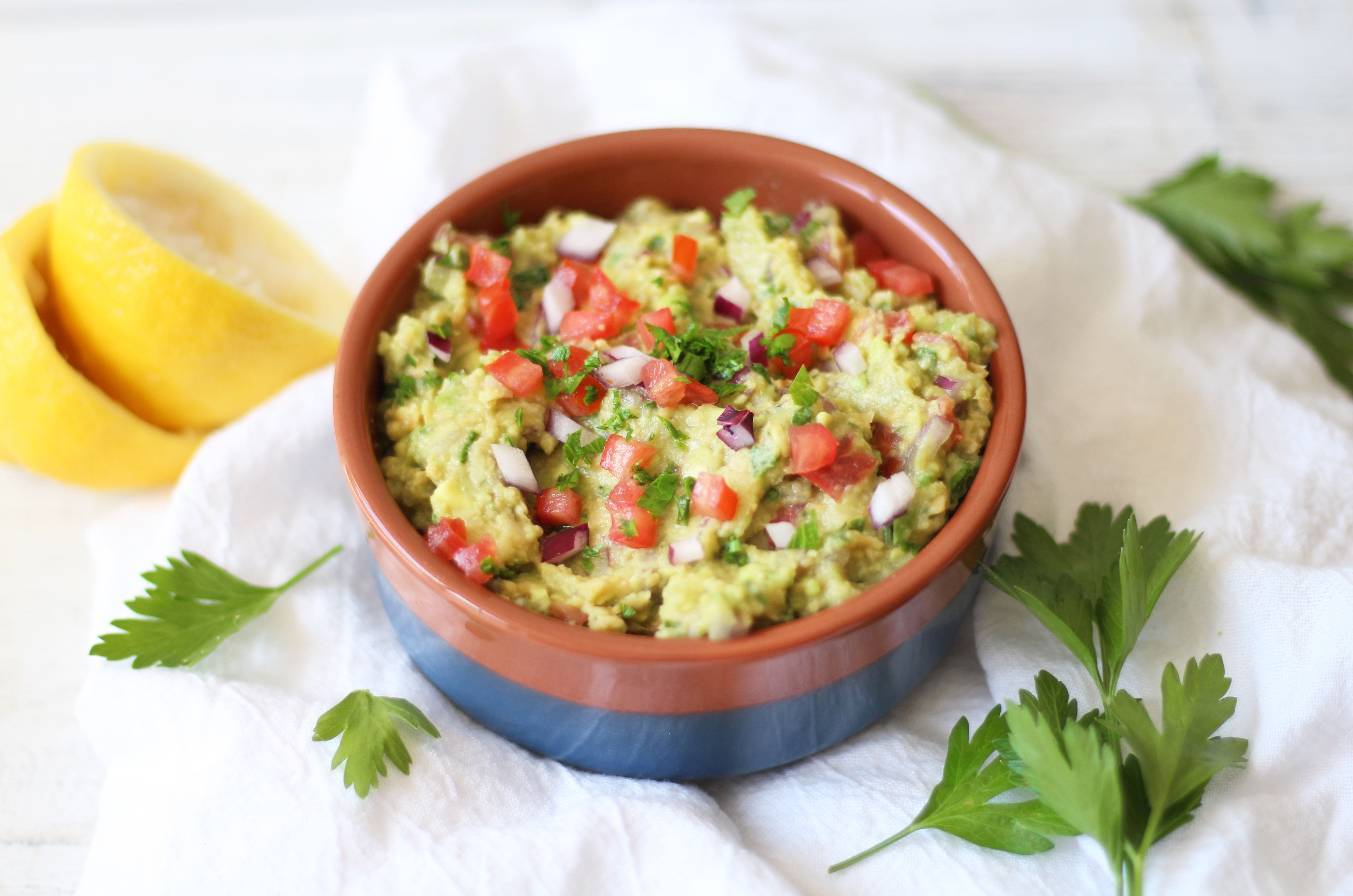 Mediterranean Chickpea Guacamole - a fun twist on the classic with the addition of chickpeas! A tasty snack, and not to mention cheaper ingredients!