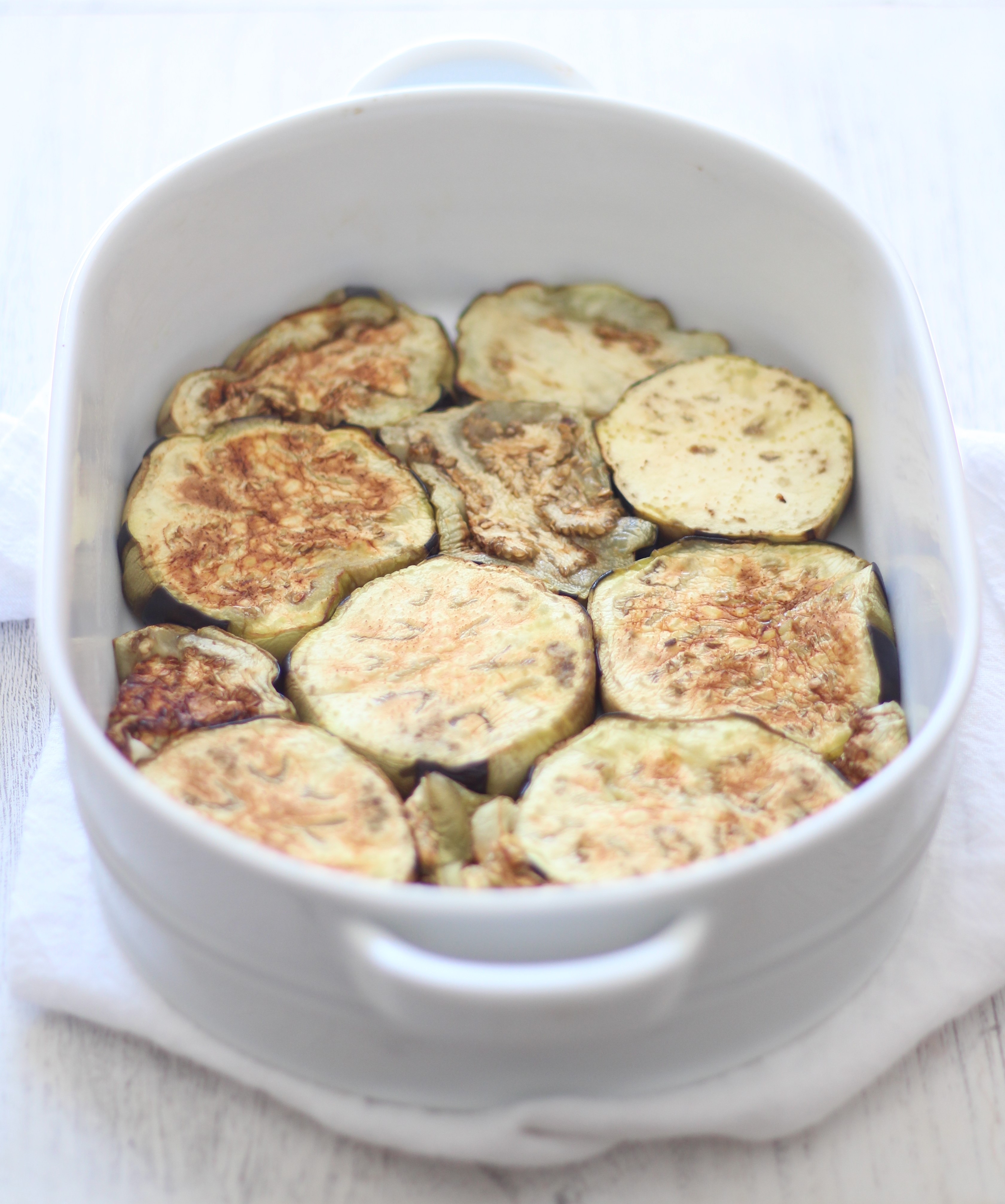 A comforting and healthy Mediterranean casserole with layers of eggplant, caramelized onions, chickpeas, and tomatoes - and simple to prepare!