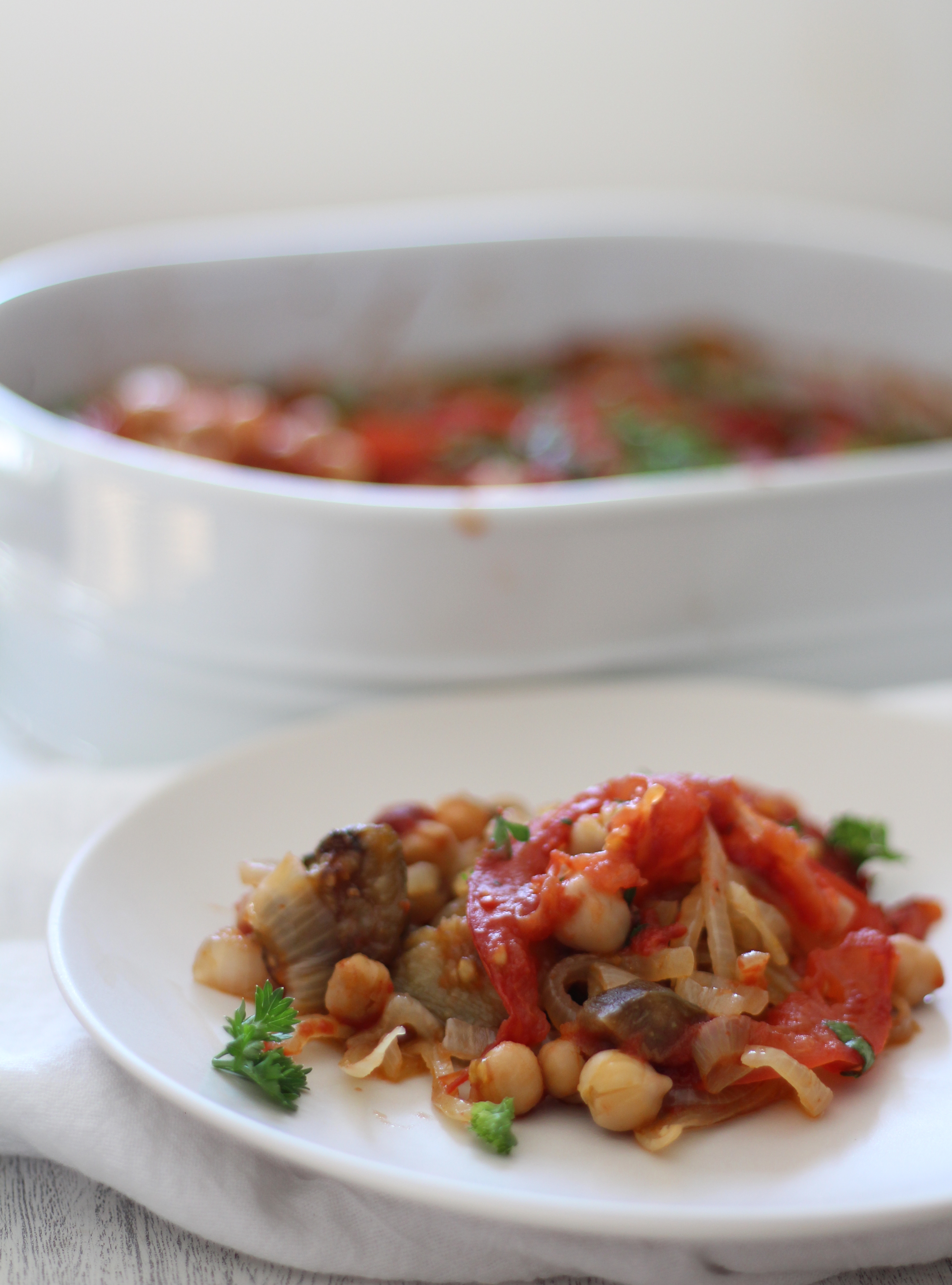 A comforting and healthy Mediterranean casserole with layers of eggplant, caramelized onions, chickpeas, and tomatoes - and simple to prepare!