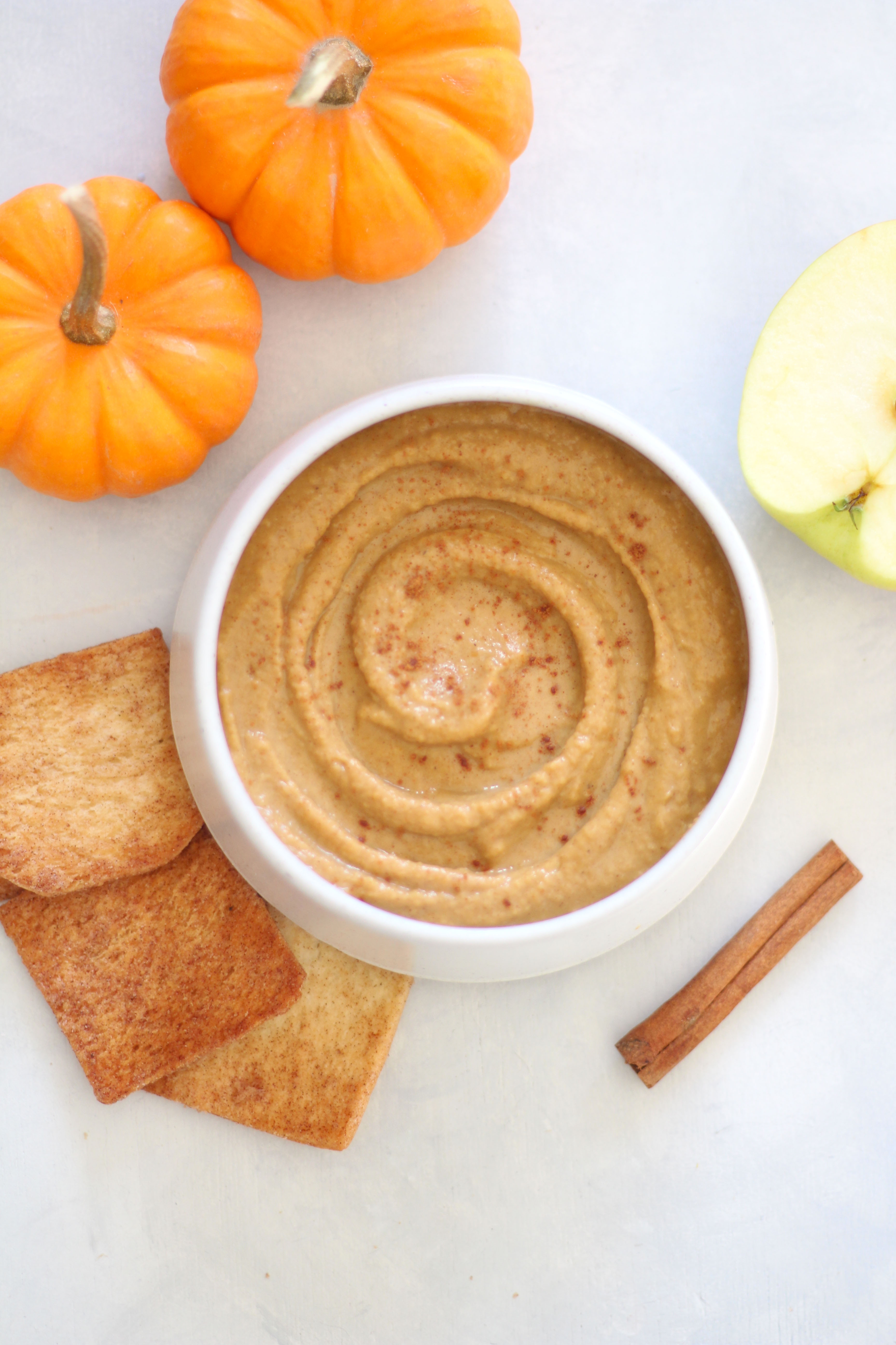 Pumpkin Pie Dessert Hummus - a healthy and sweet fall dip that's great on apples, graham crackers, and cinnamon sugar pita chips!