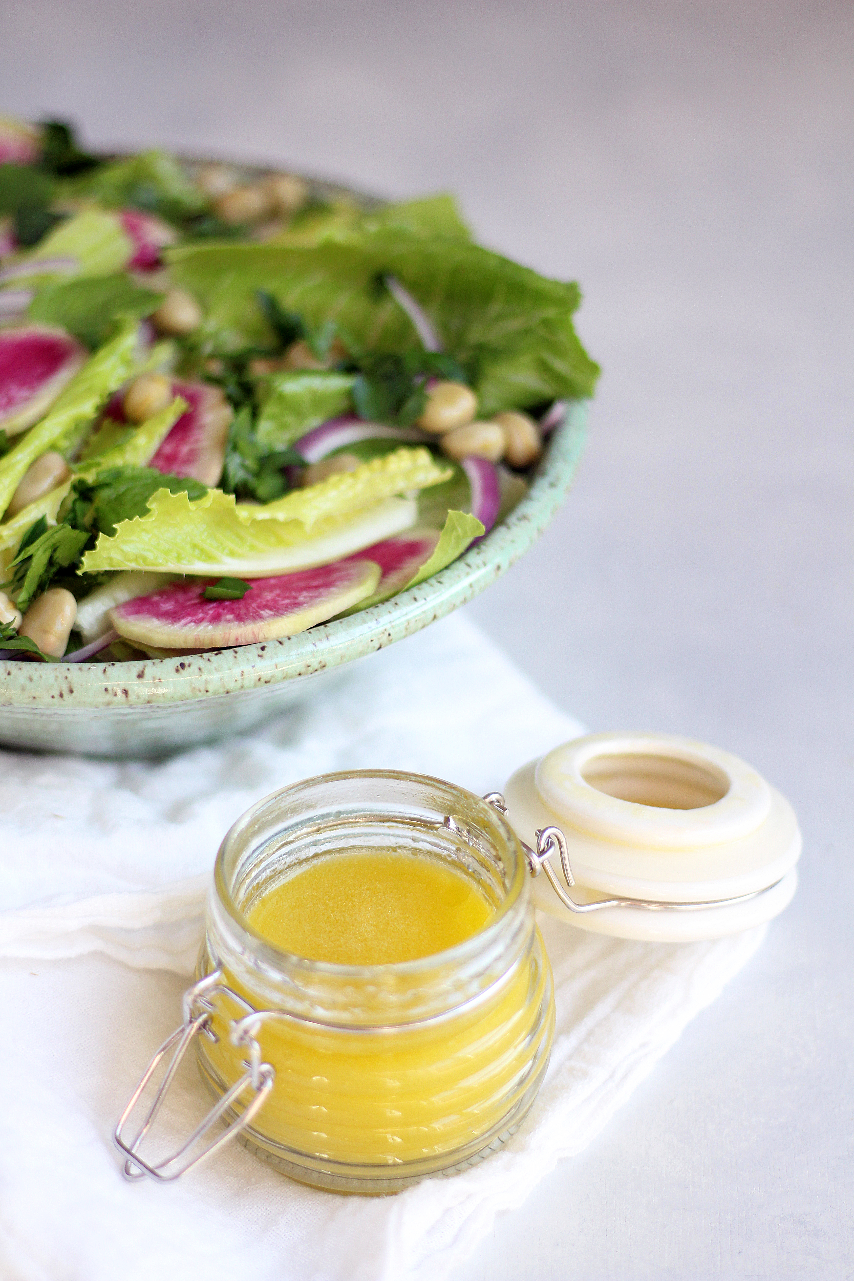 Crunchy romaine salad with fava beans, watermelon radishes, feta, and herbs. 