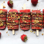 The juiciest strawberry popsicles with rose water and topped with chocolate and pistachios. The perfect sweet treat in summer! (GF, V, Refined sugar free)